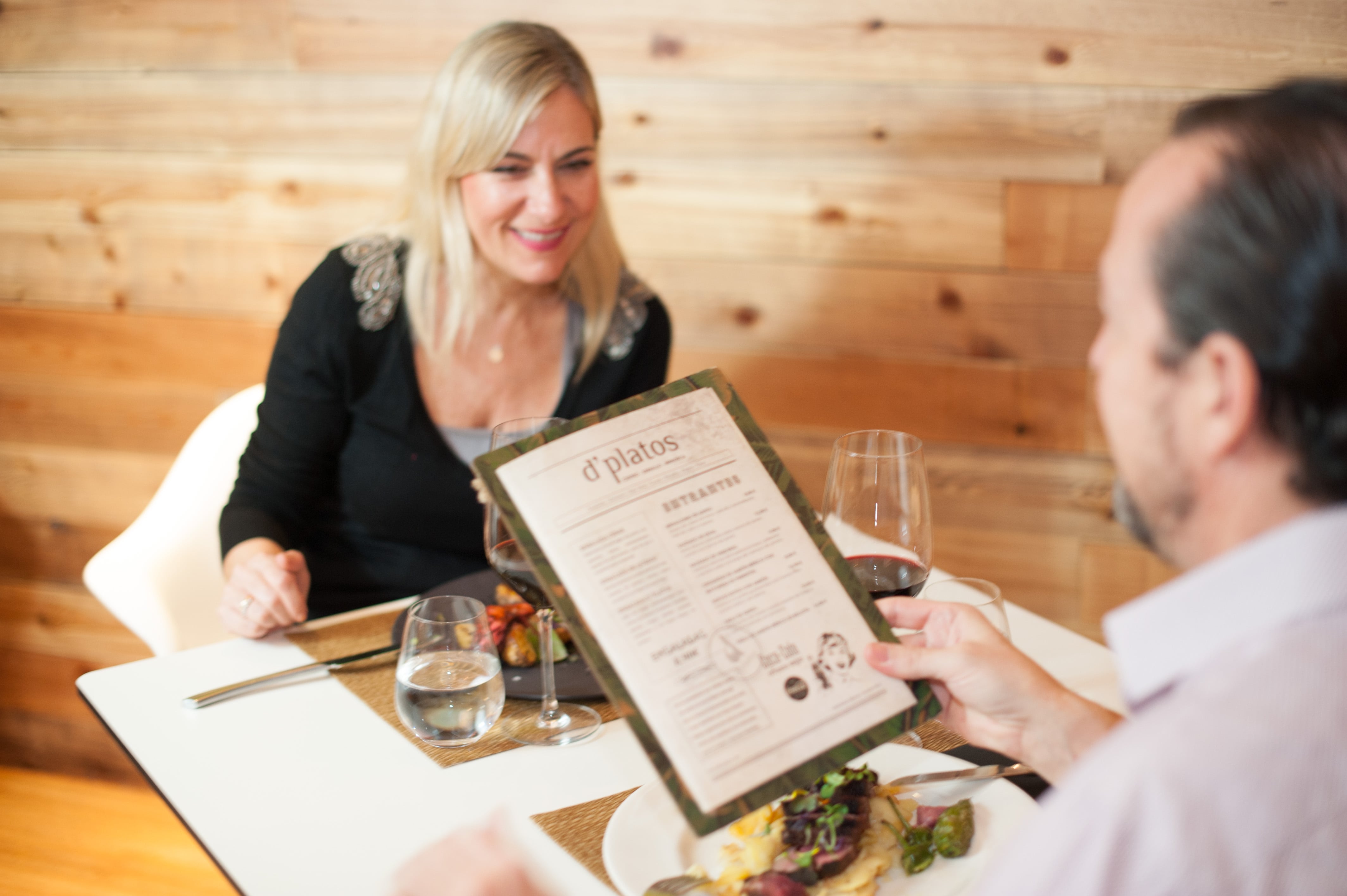 woman and man looking at menu