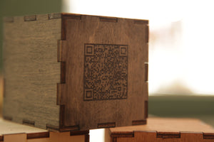 Wooden cube with the number and qr-code