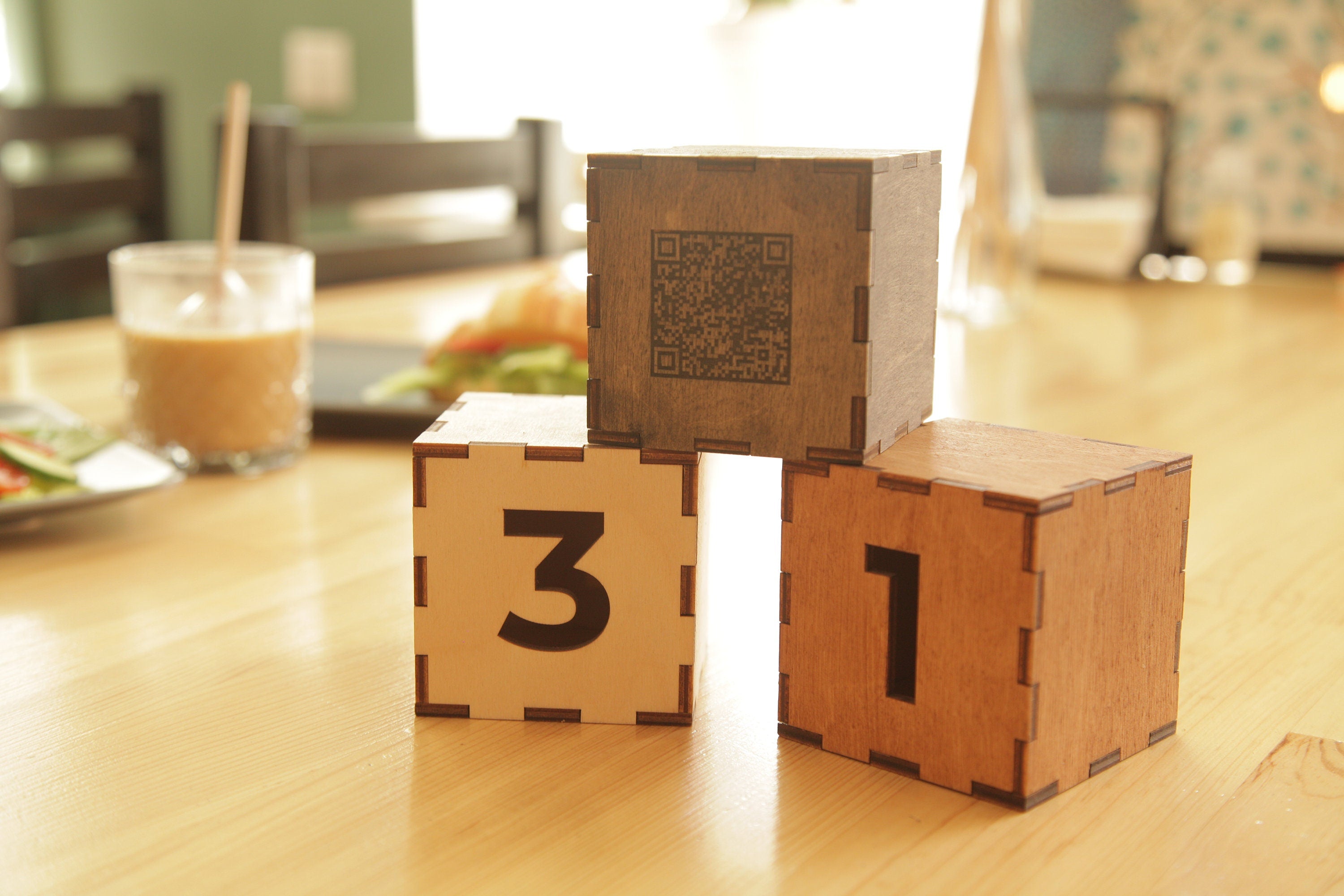 Wooden cube with the number and qr-code